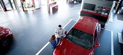 Family at a car dealership