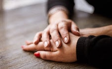 Holding hands on table