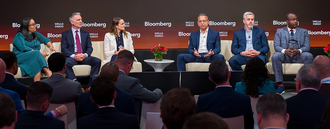 Wells Fargo and Bloomberg logos behind group of panelists